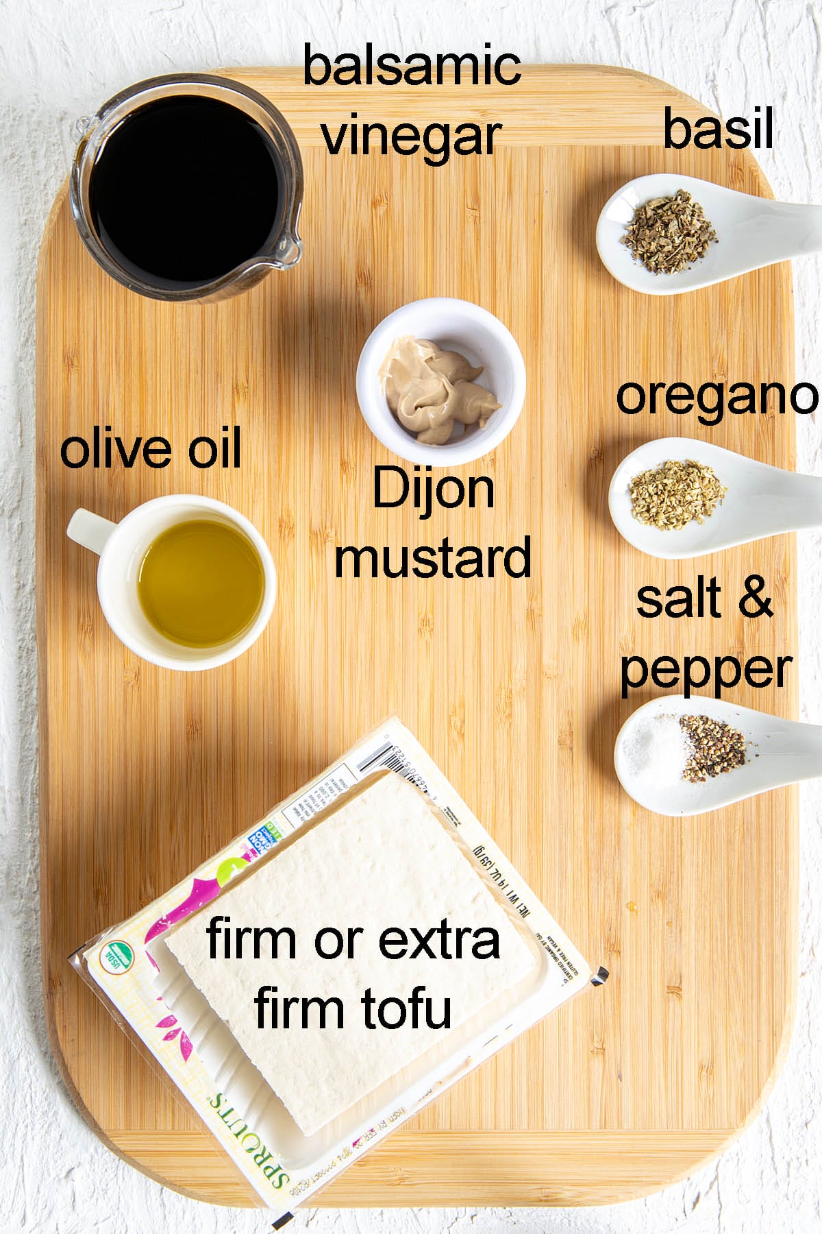 Ingredients for balsamic tofu on a cutting board with labels.