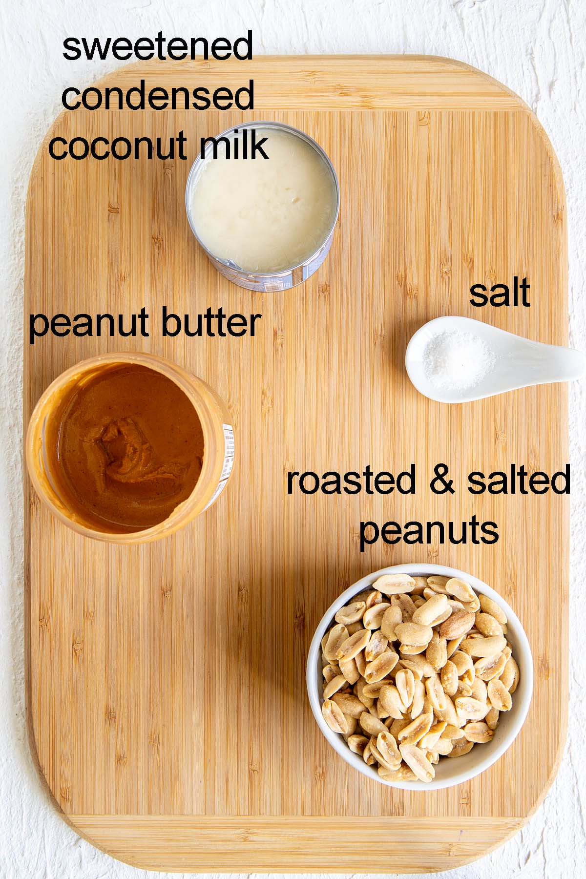 Ingredients for copycat payday bars on a cutting board with labels.