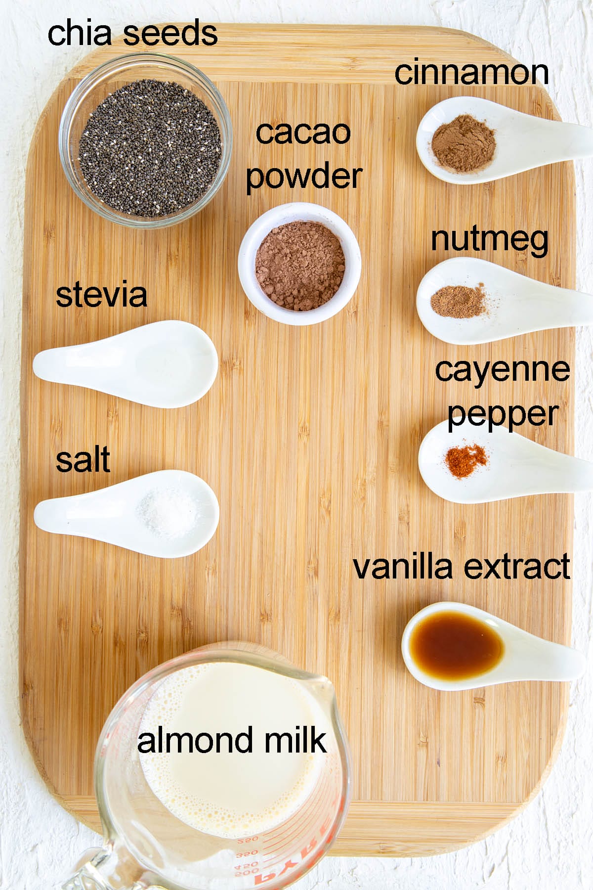 Ingredients for Mexican chia pudding on a cutting board with labels.