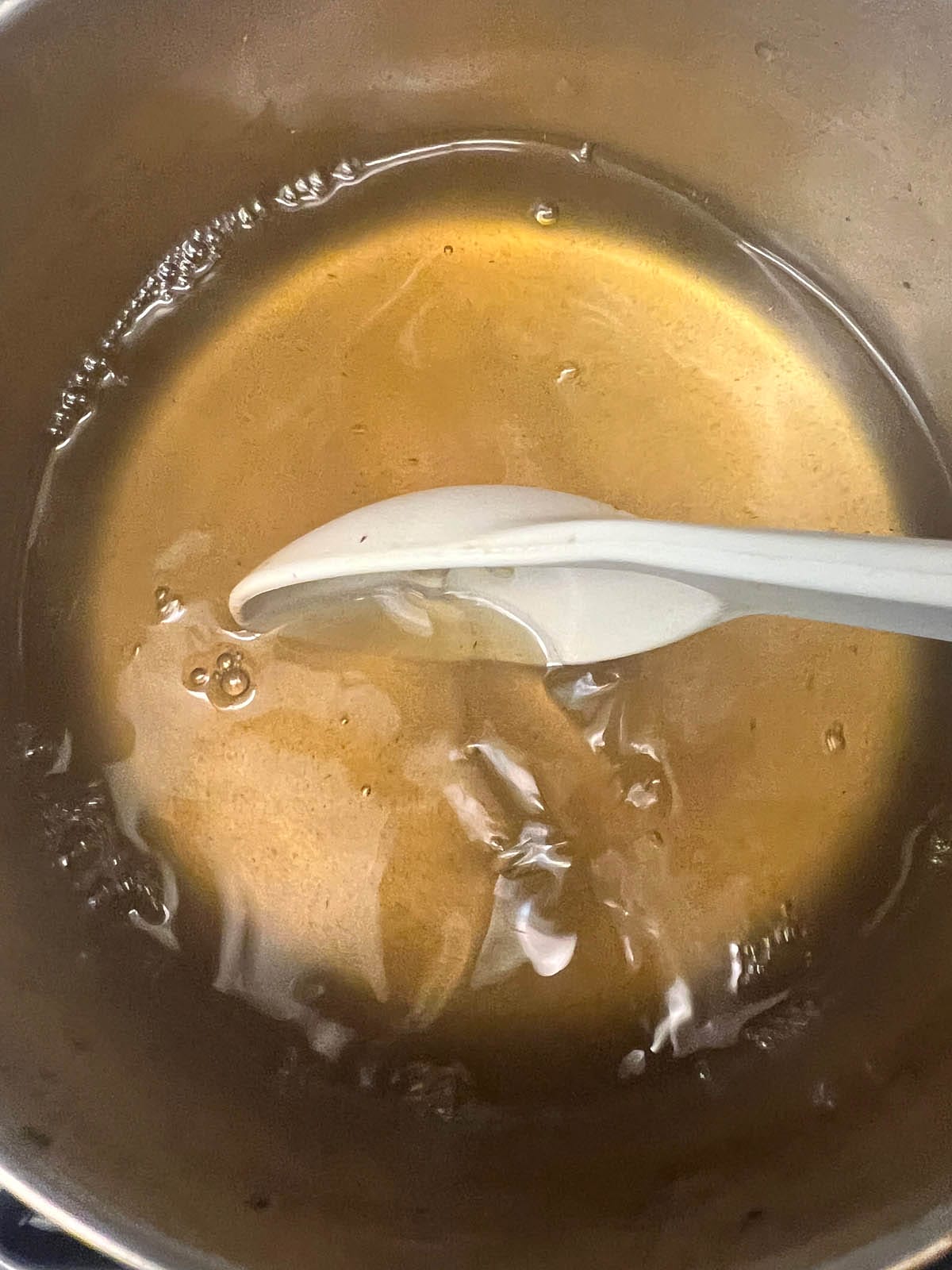 Saucepan with Yerba mate tea and dissolved sugar.