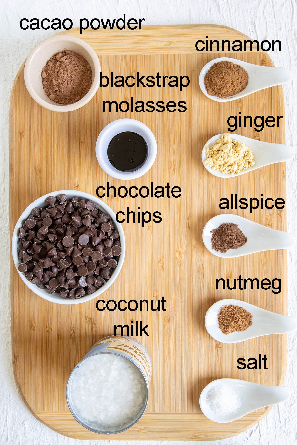 Ingredients for gingerbread truffles on a cutting board with labels.
