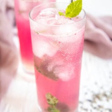 Lavender Mojito in two tall glasses with ice.