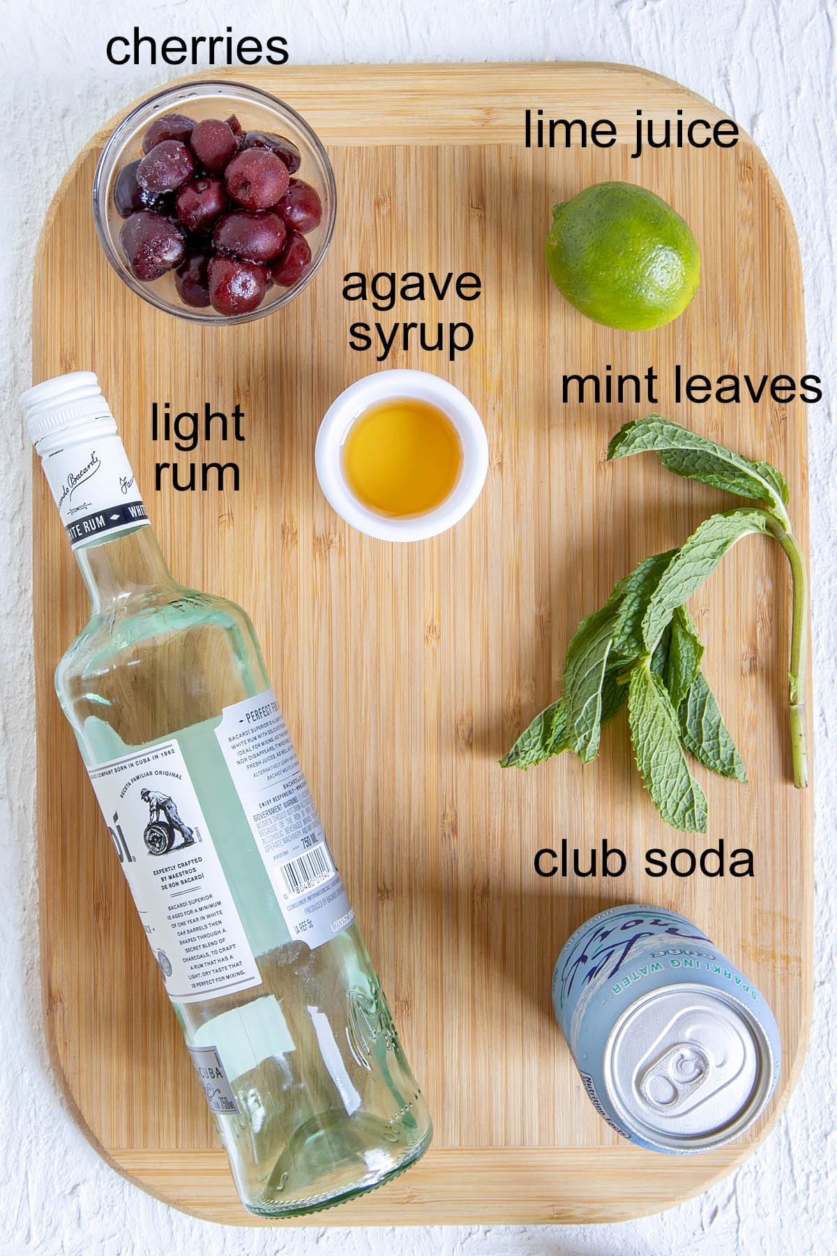 Cherry Mojito ingredients on a cutting board with labels.