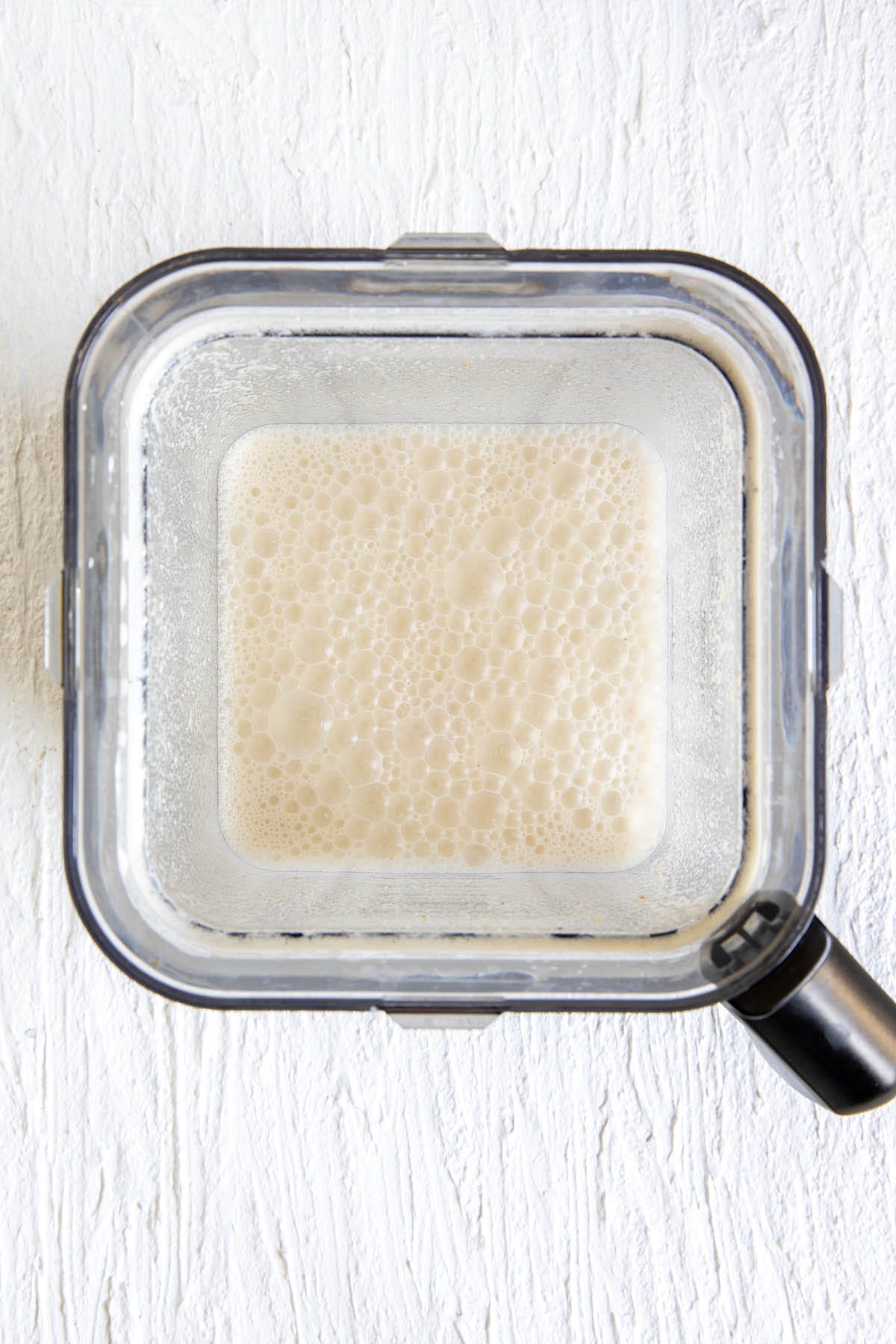Walnut milk in a blender.