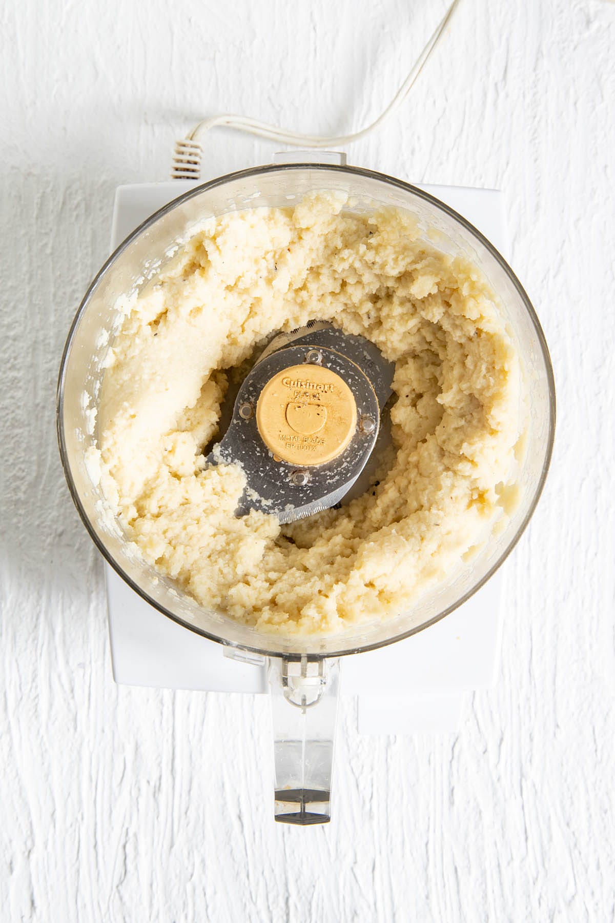 Mashed cauliflower in a food processor.