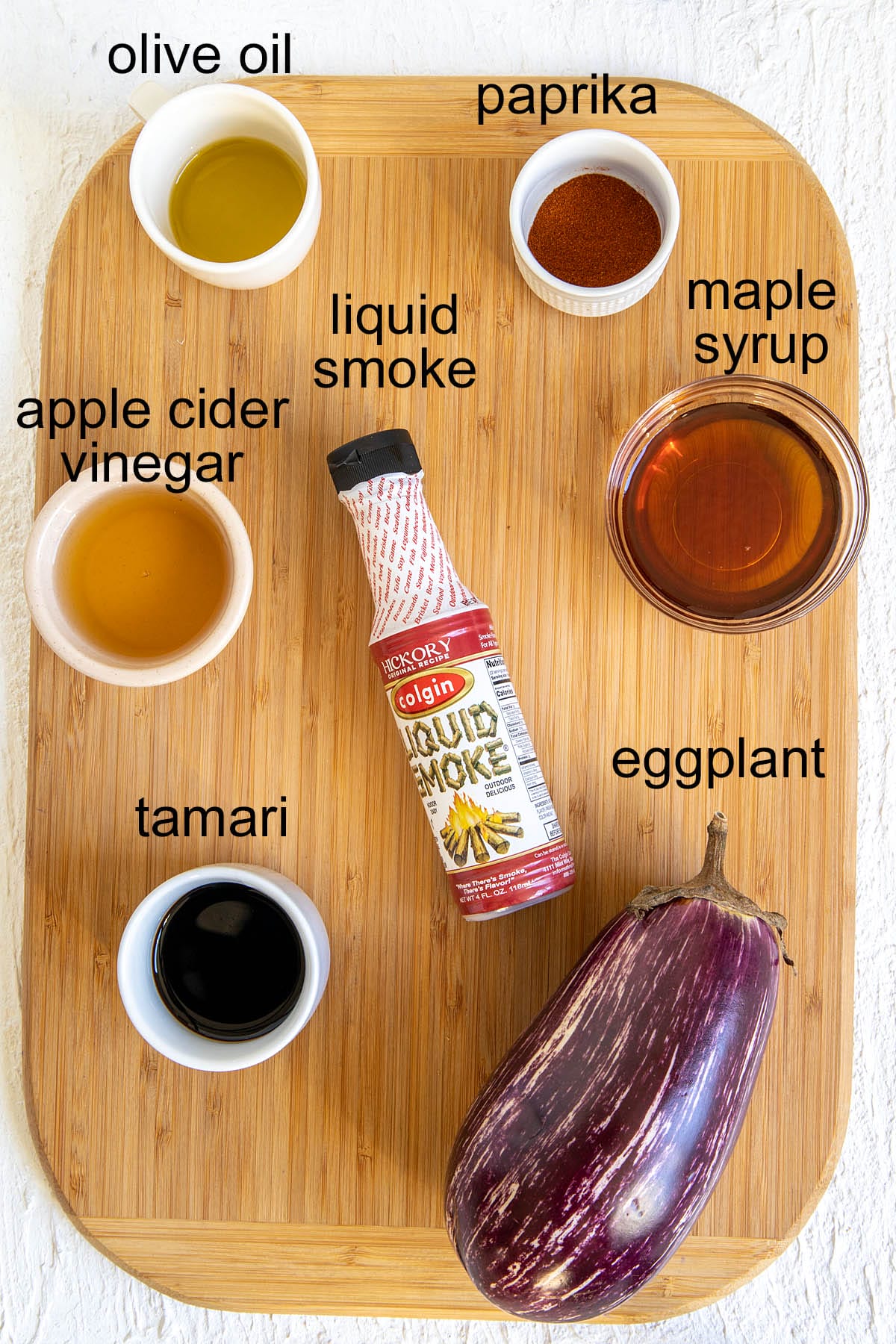 Eggplant bacon ingredients on a cutting board with labels.