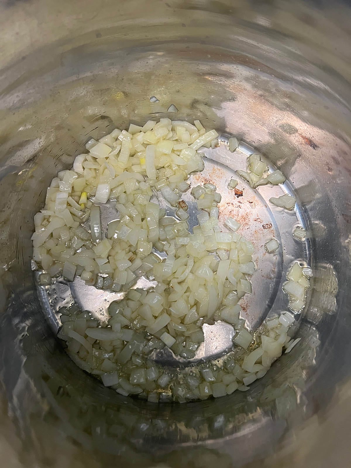 Sauteed onions in a large stock pot.