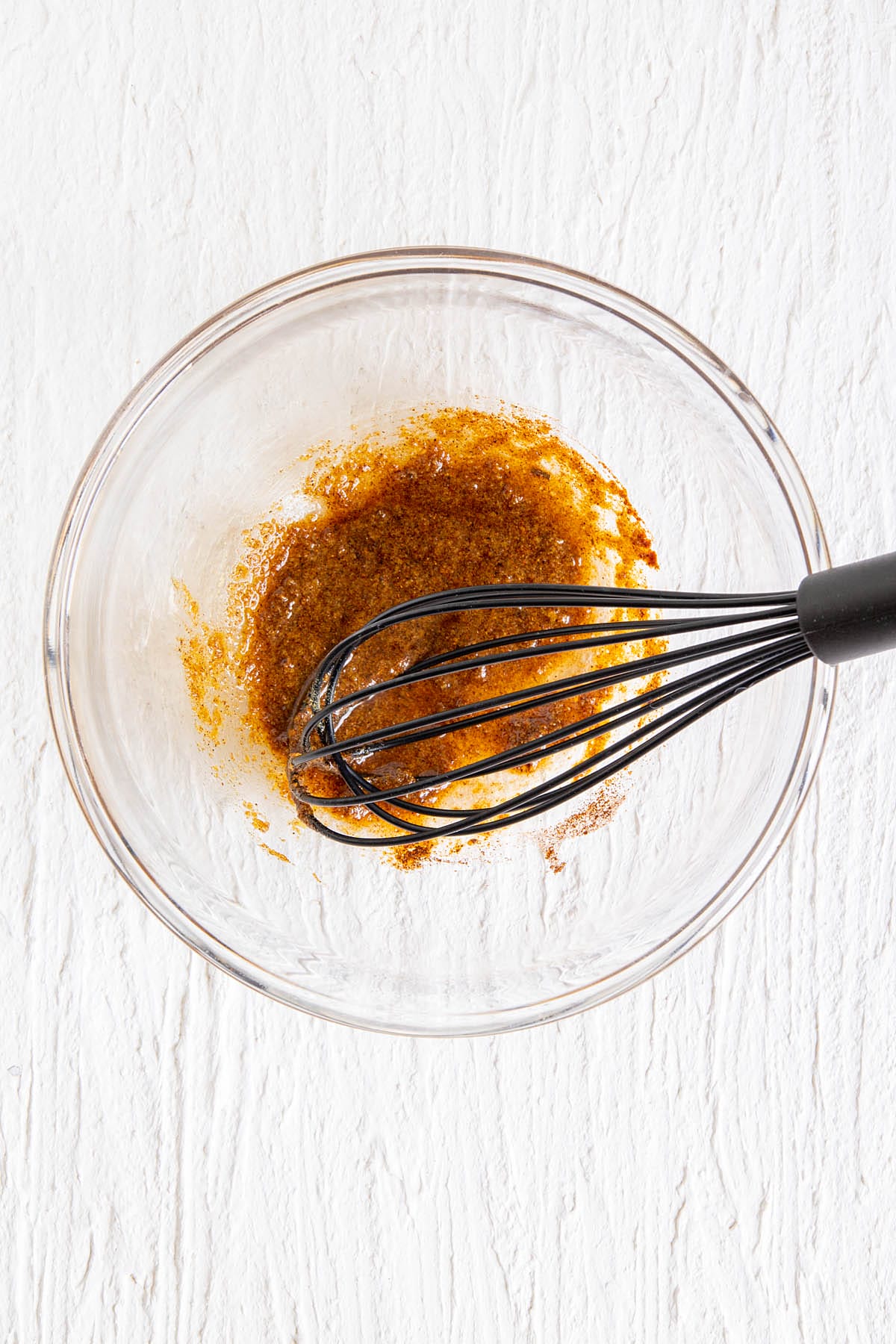Seasonings in a large mixing bowl with whisk.