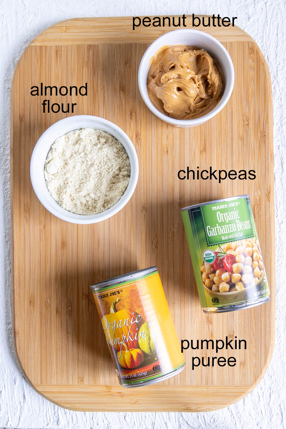 Pumpkin Chickpea Blondies ingredients on a cutting board with labels.