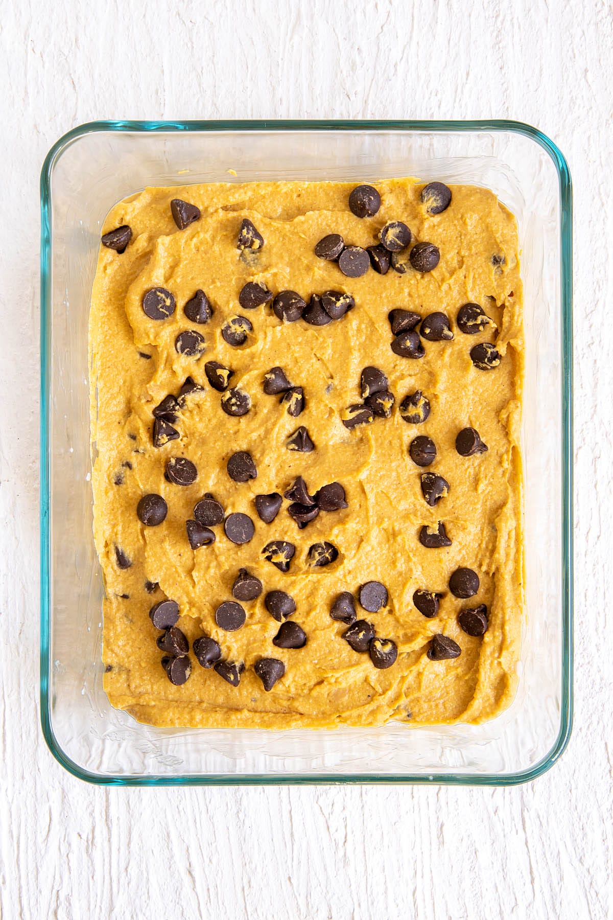 Pumpkin chickpea blondie mixture in a baking dish.