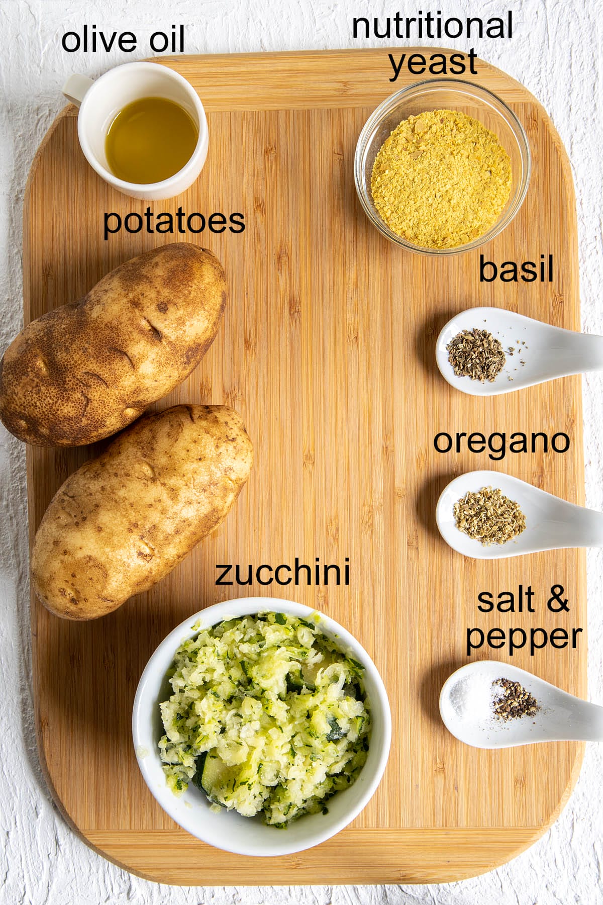 Zucchini Tots ingredients on a cutting board with labels.