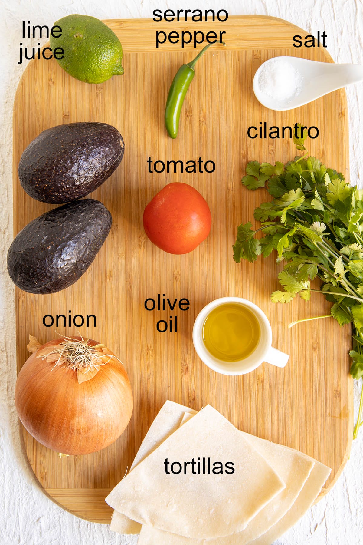 Ingredients on a cutting board with labels.