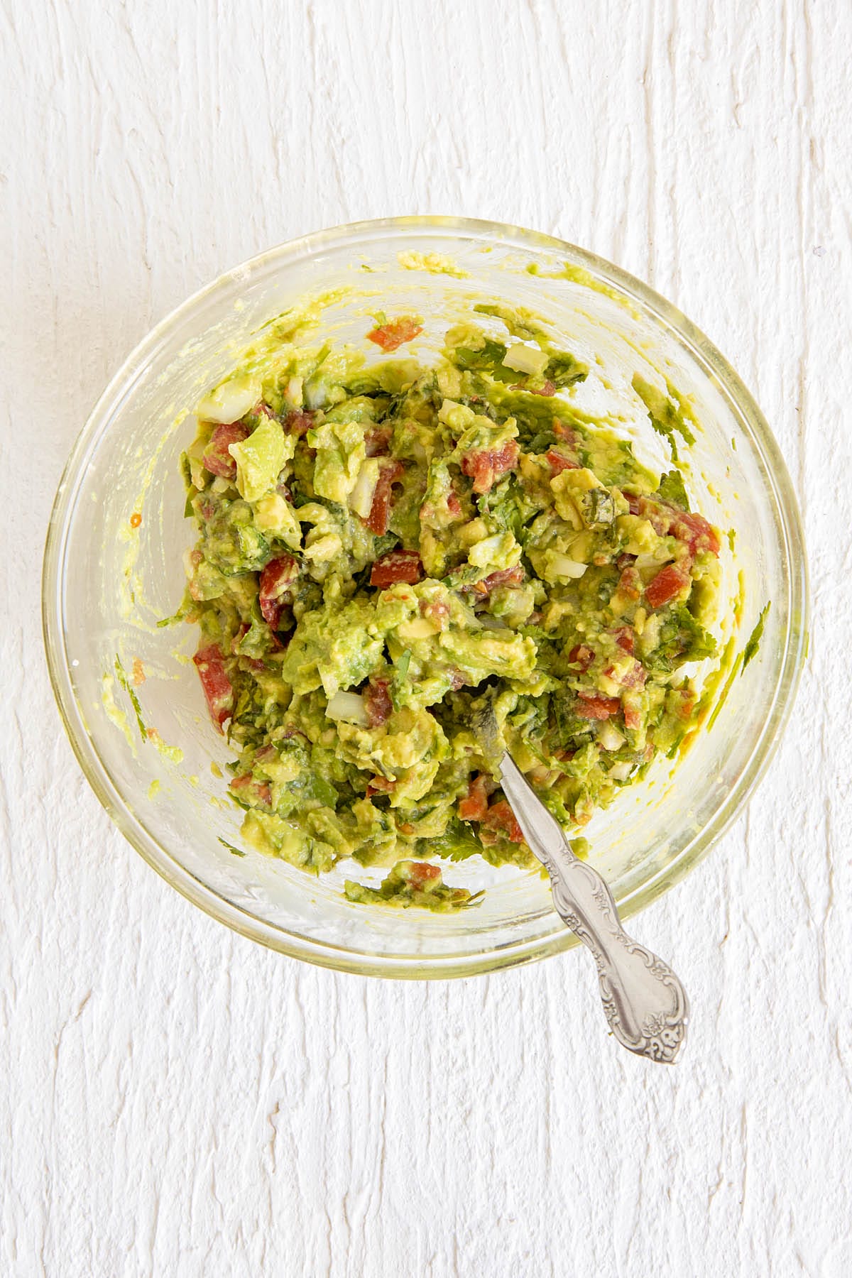 Guacamole in a large bowl with fork.