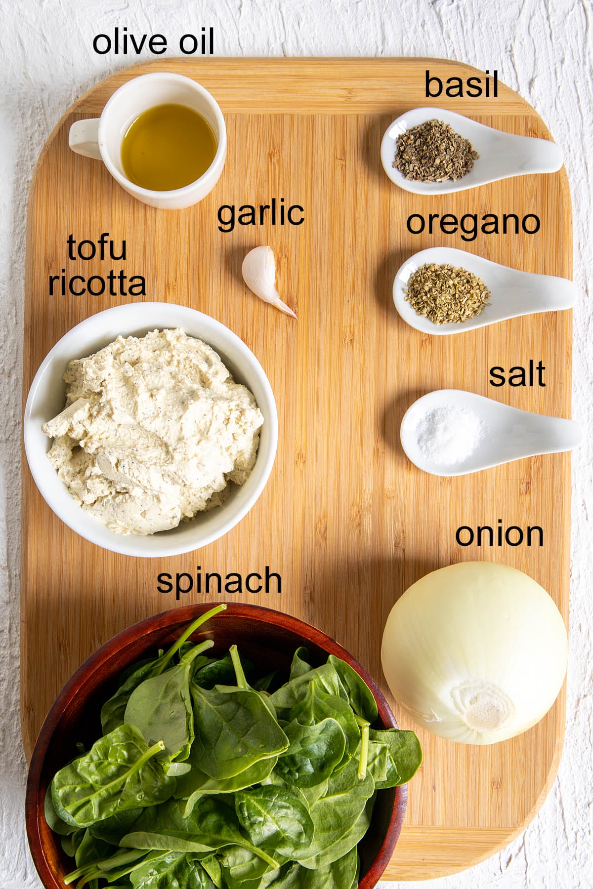 Ingredients on a cutting board with labels.
