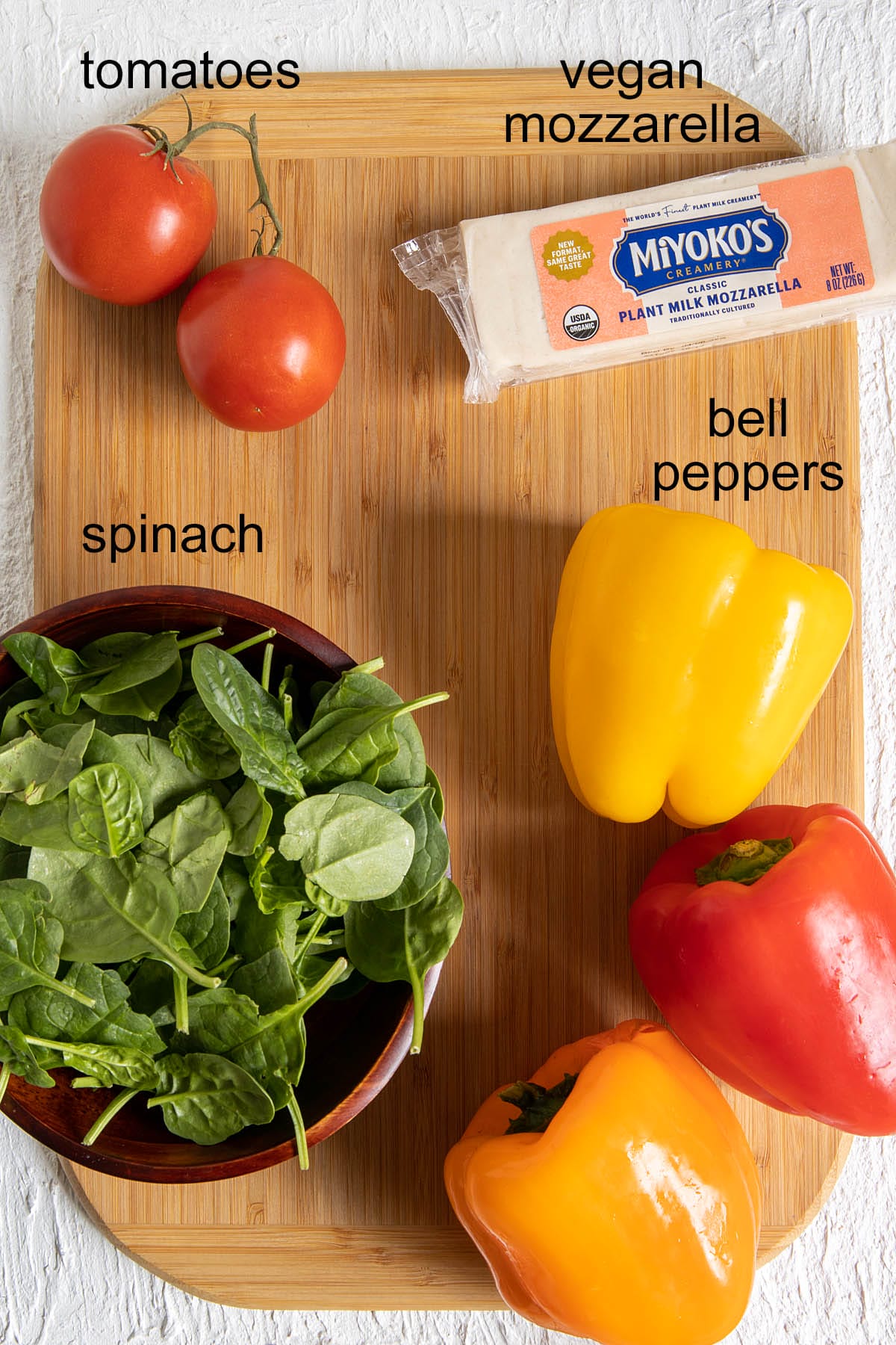 Ingredients on a cutting board with labels.