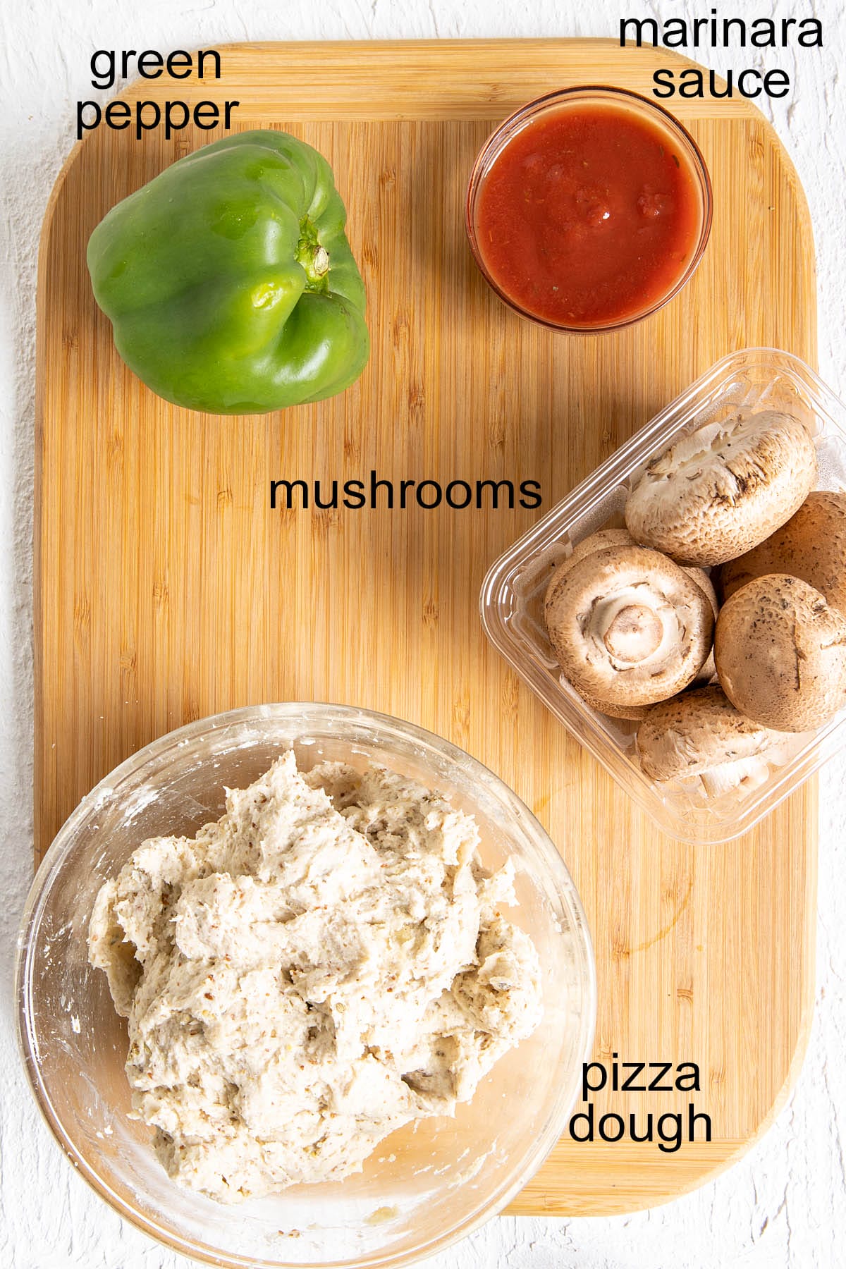 Ingredients on a cutting board with labels.