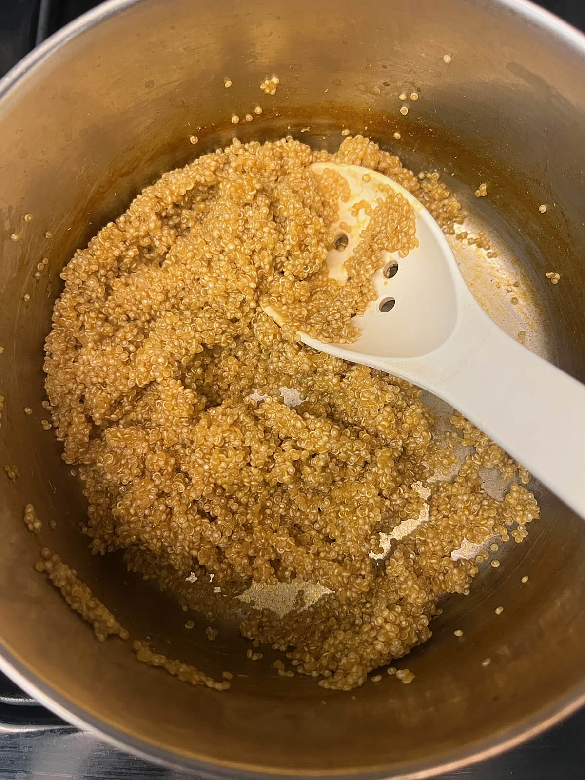 Cooked quinoa in a saucepan.
