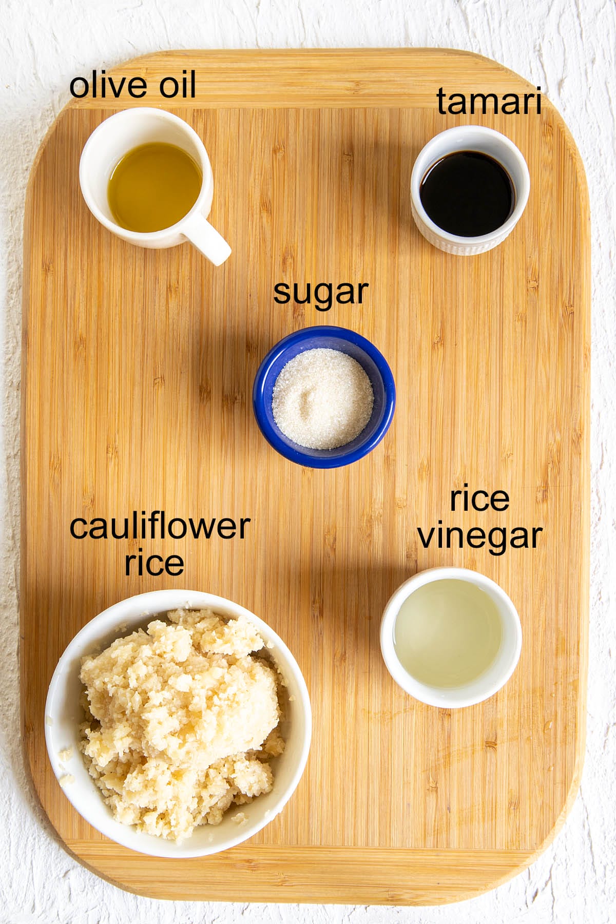 Ingredients on a cutting board with labels.
