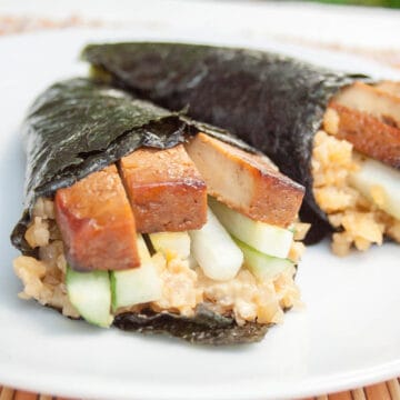 Baked Tofu Temaki Sushi with Cauliflower Rice on a plate.