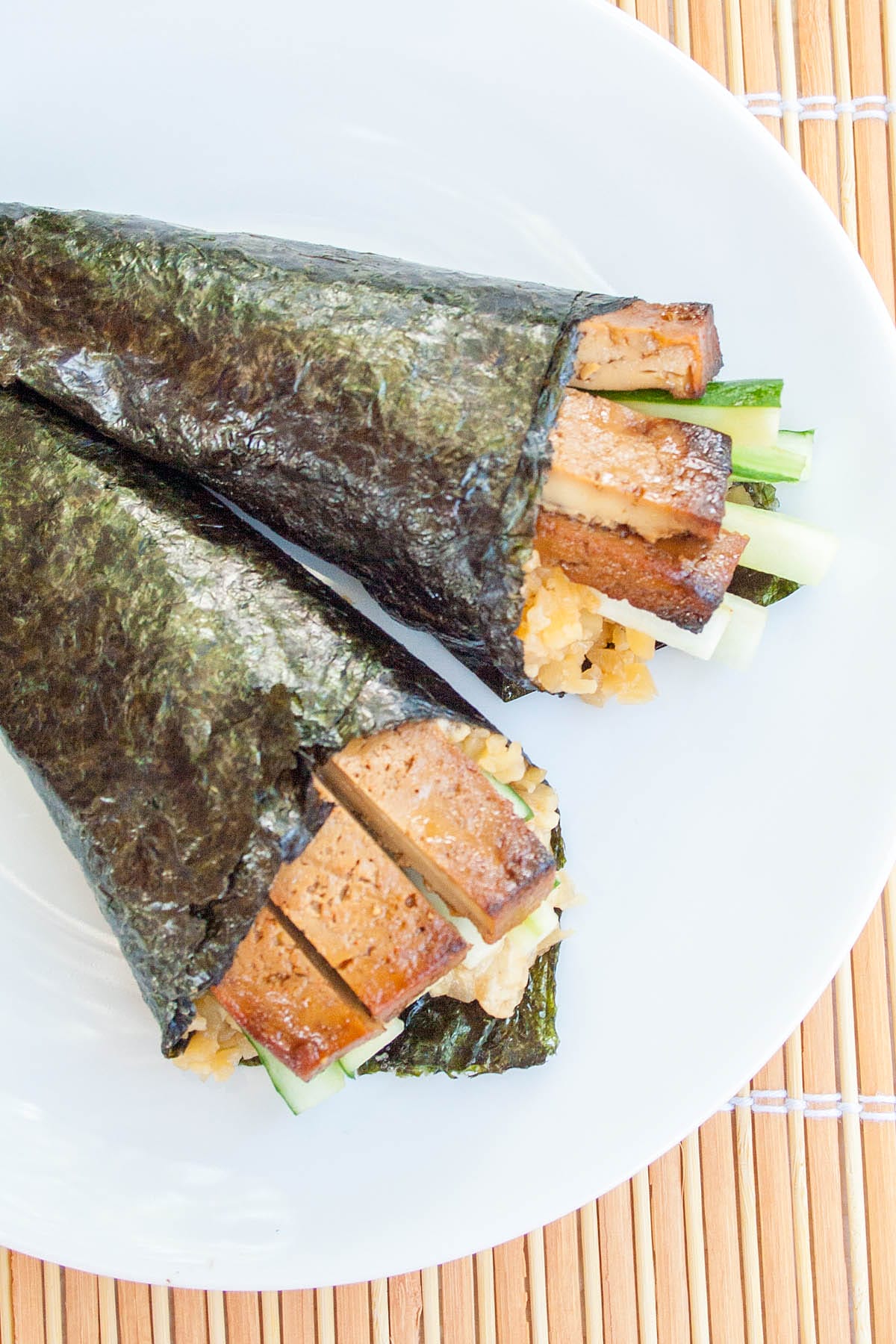 Baked Tofu Temaki Sushi with Cauliflower Rice on a plate.