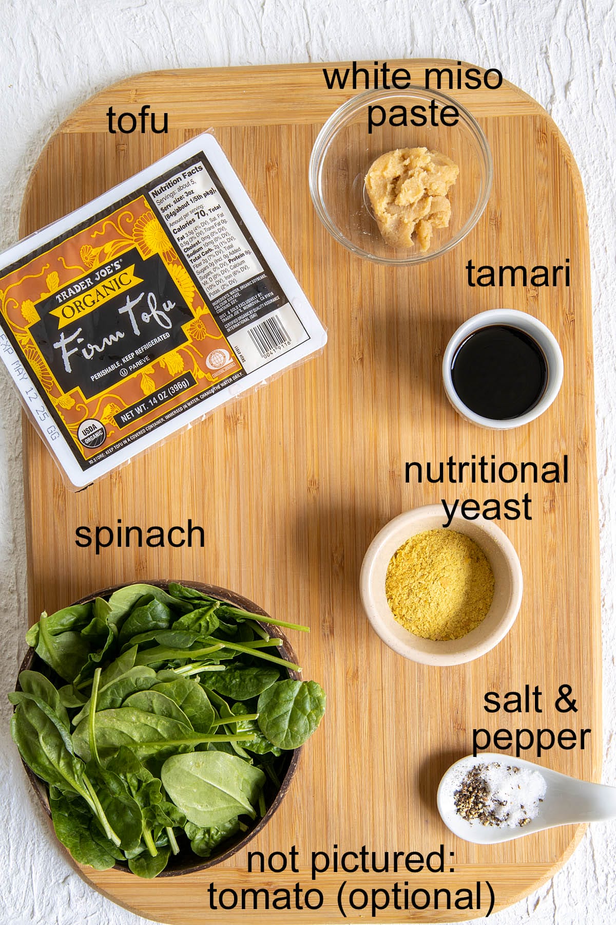 Ingredients on a cutting board with labels.