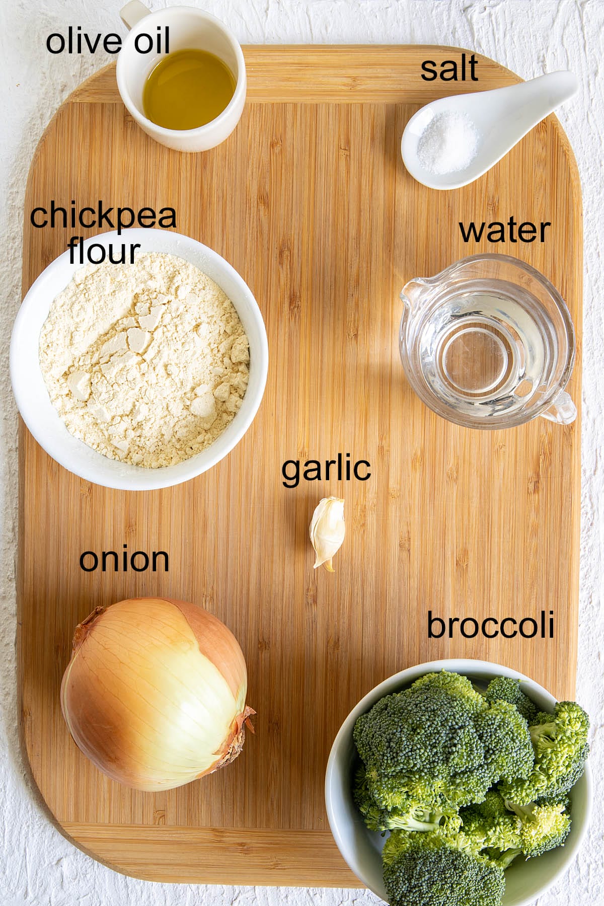 Ingredients on a cutting board with labels.