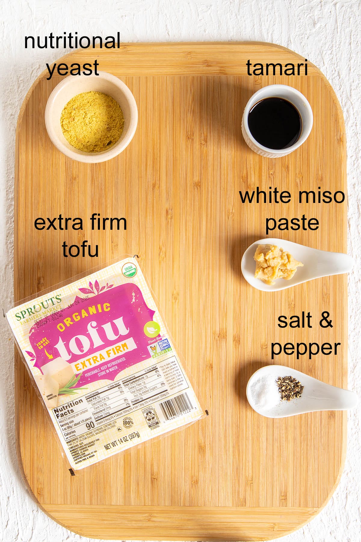 Ingredients on a cutting board with labels.