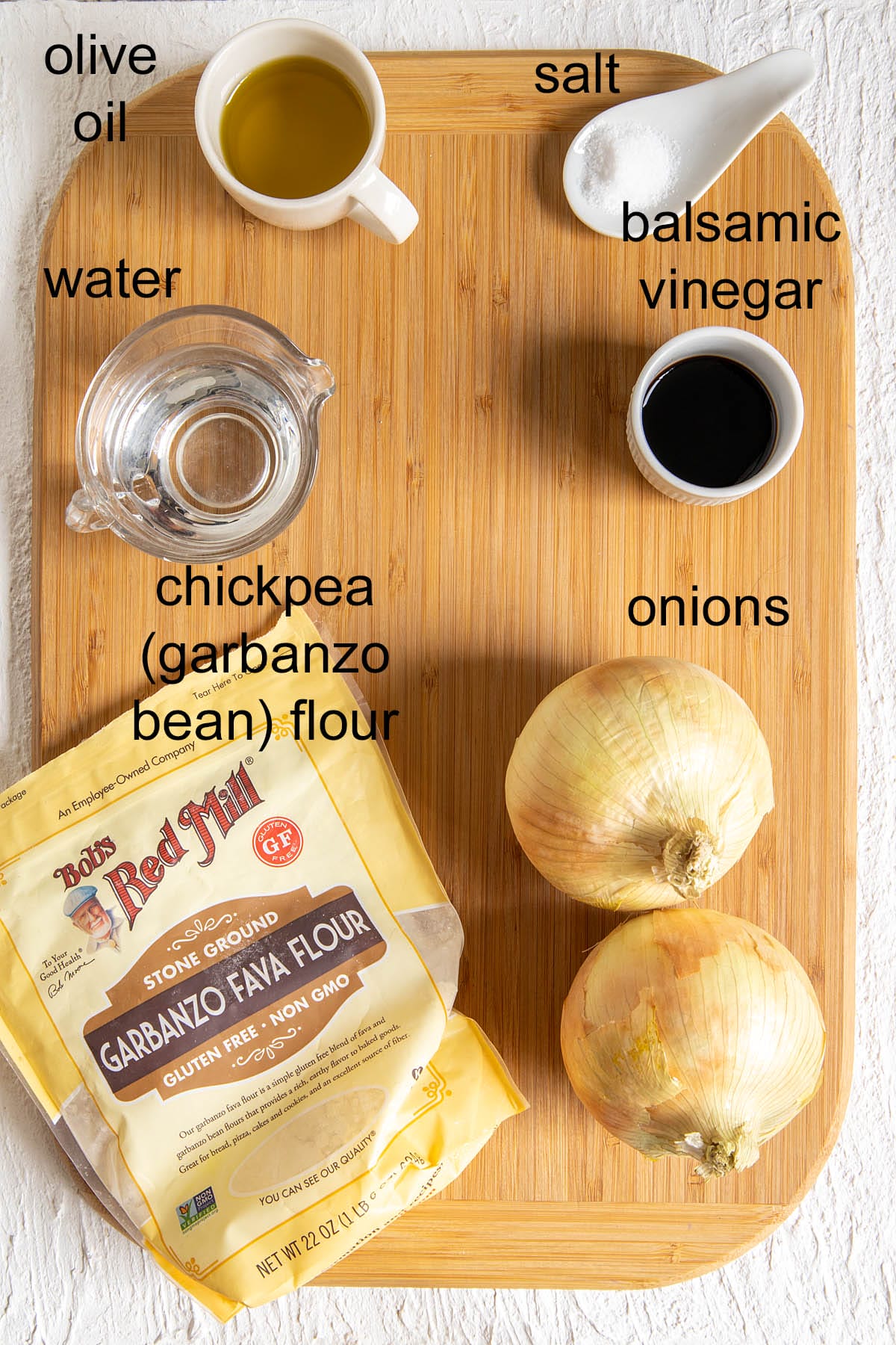 Ingredients on a cutting board with labels.