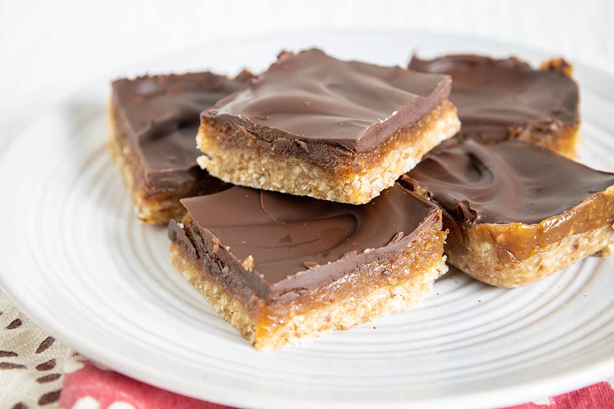 No-Bake Chocolate Peanut Butter Caramel Bars on a plate.
