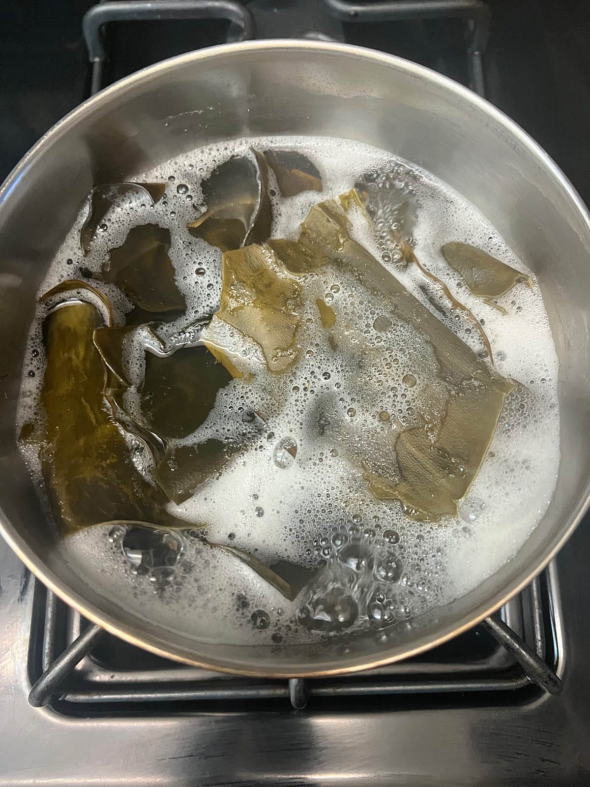 Kelp in boiling water in a saucepan.