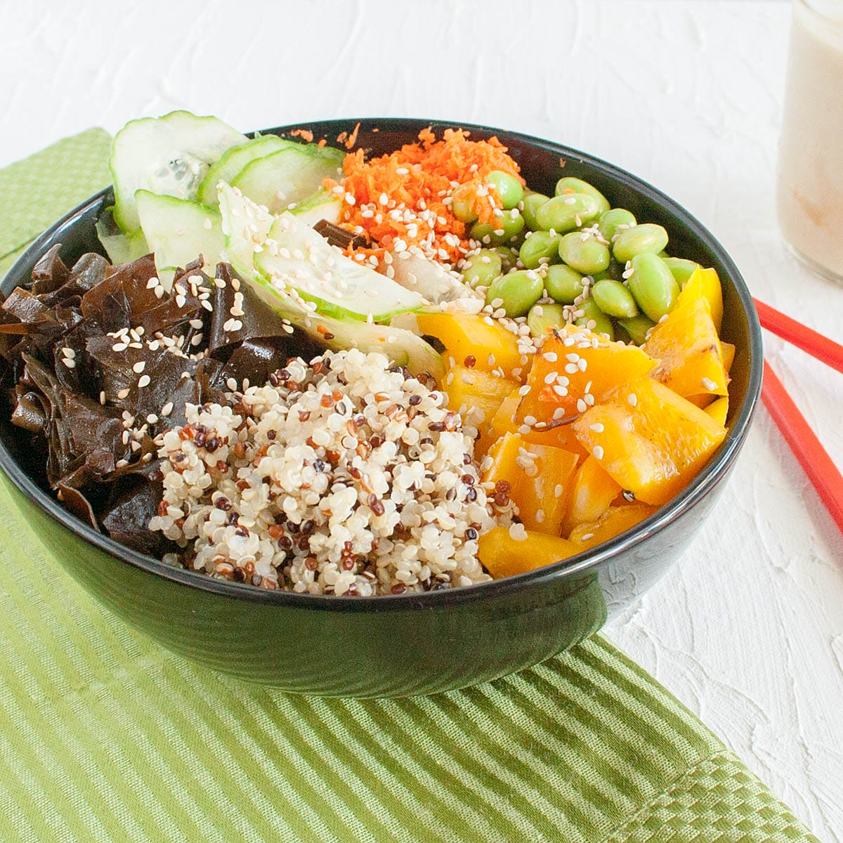 Edamame Bowl with dressing in the background.