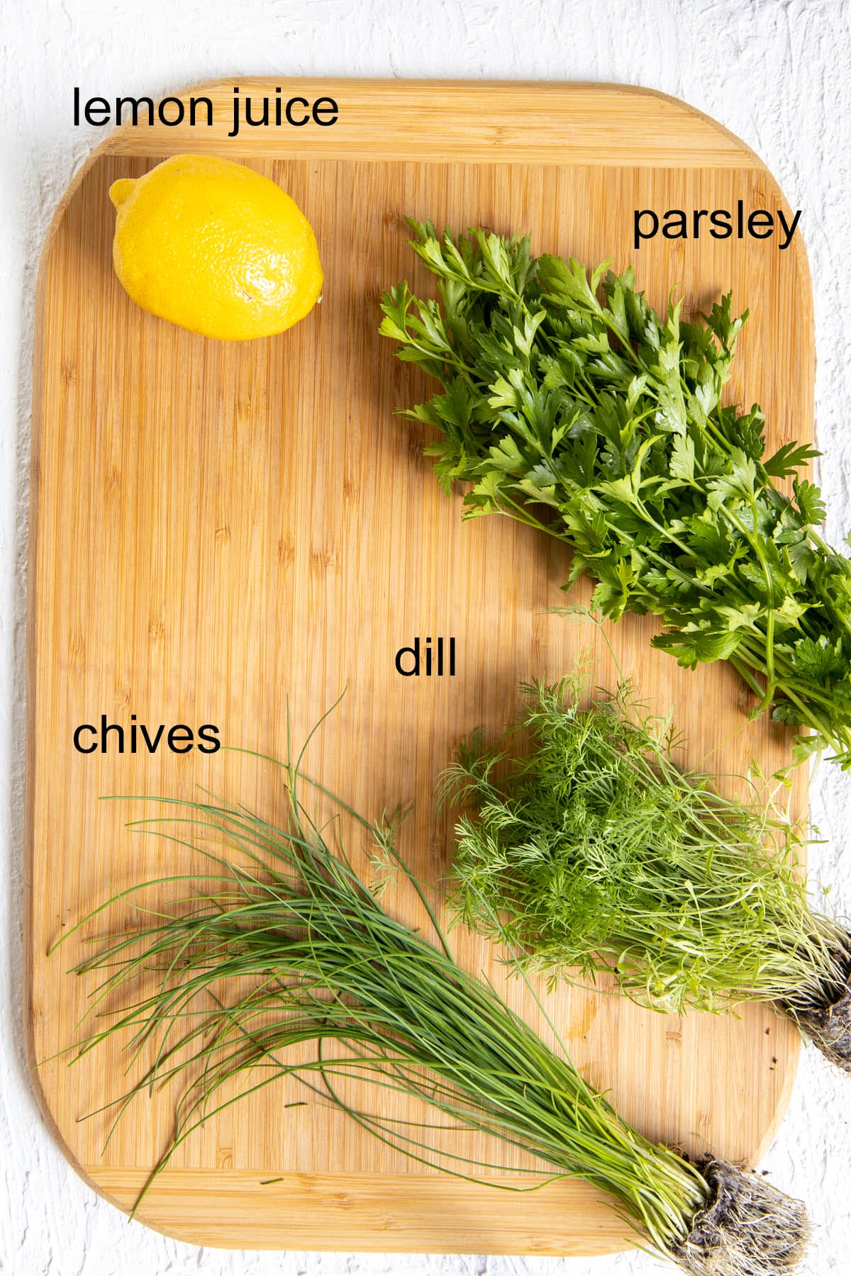 Ingredients on a cutting board with labels.
