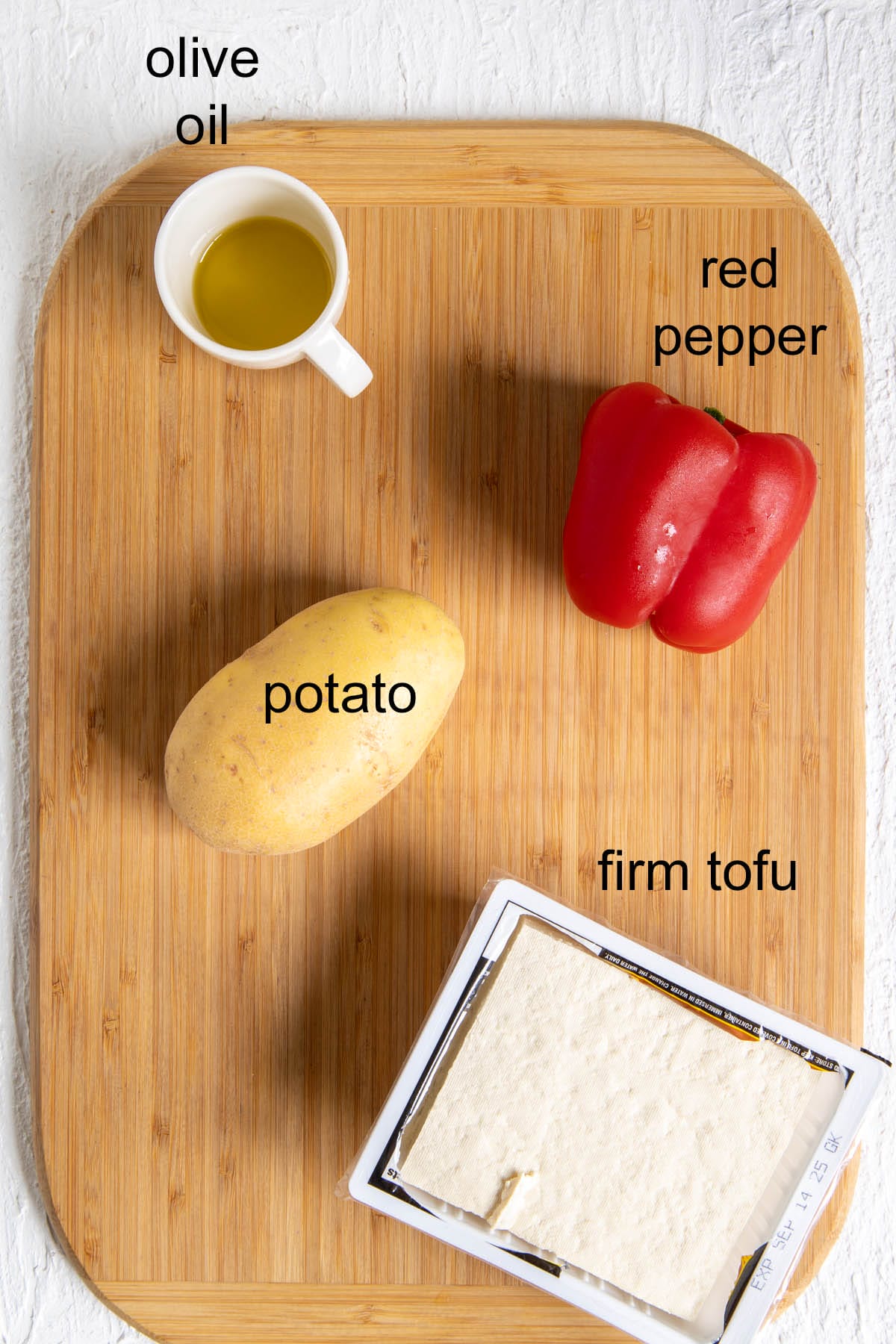 Ingredients on a cutting board with labels.