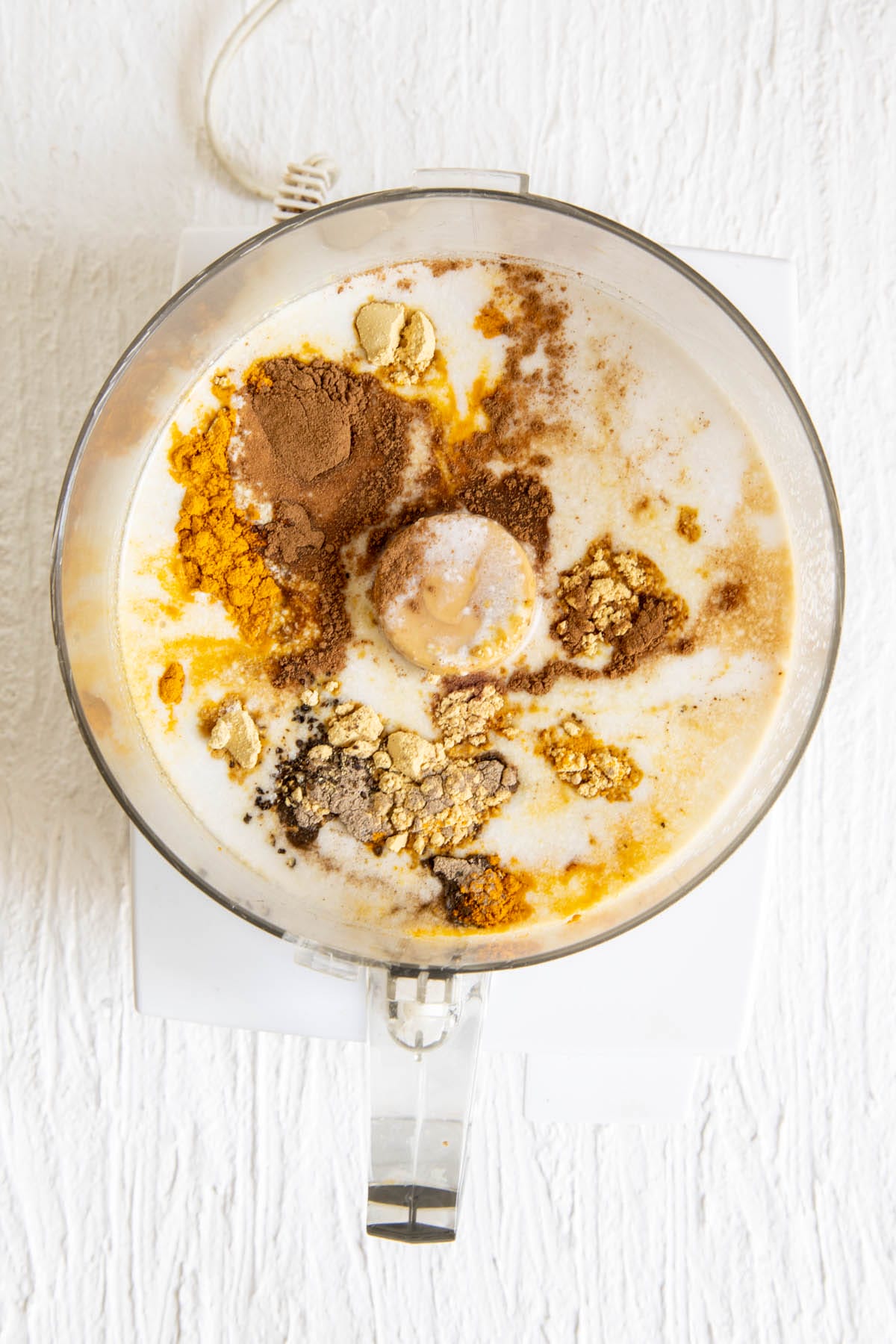 Ingredients in a food processor before blending.