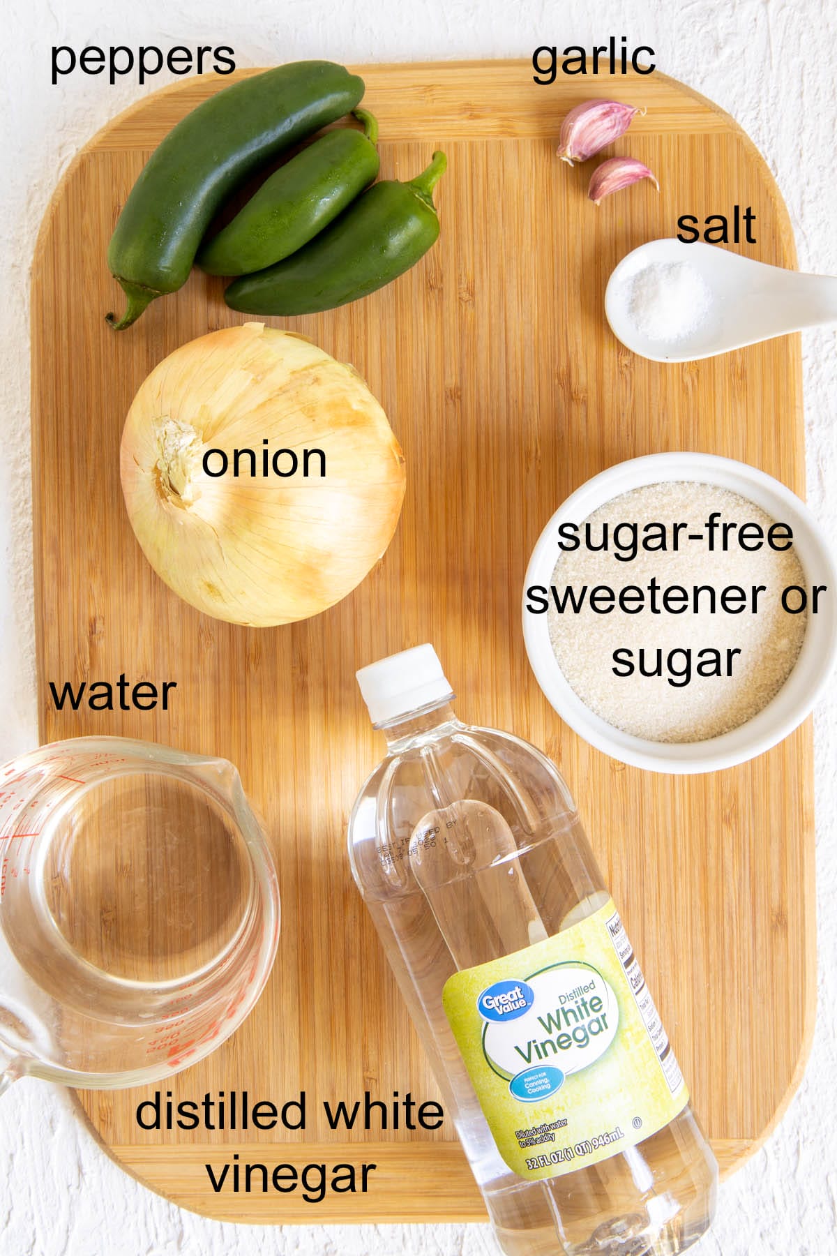 Ingredients on cutting board with labels.