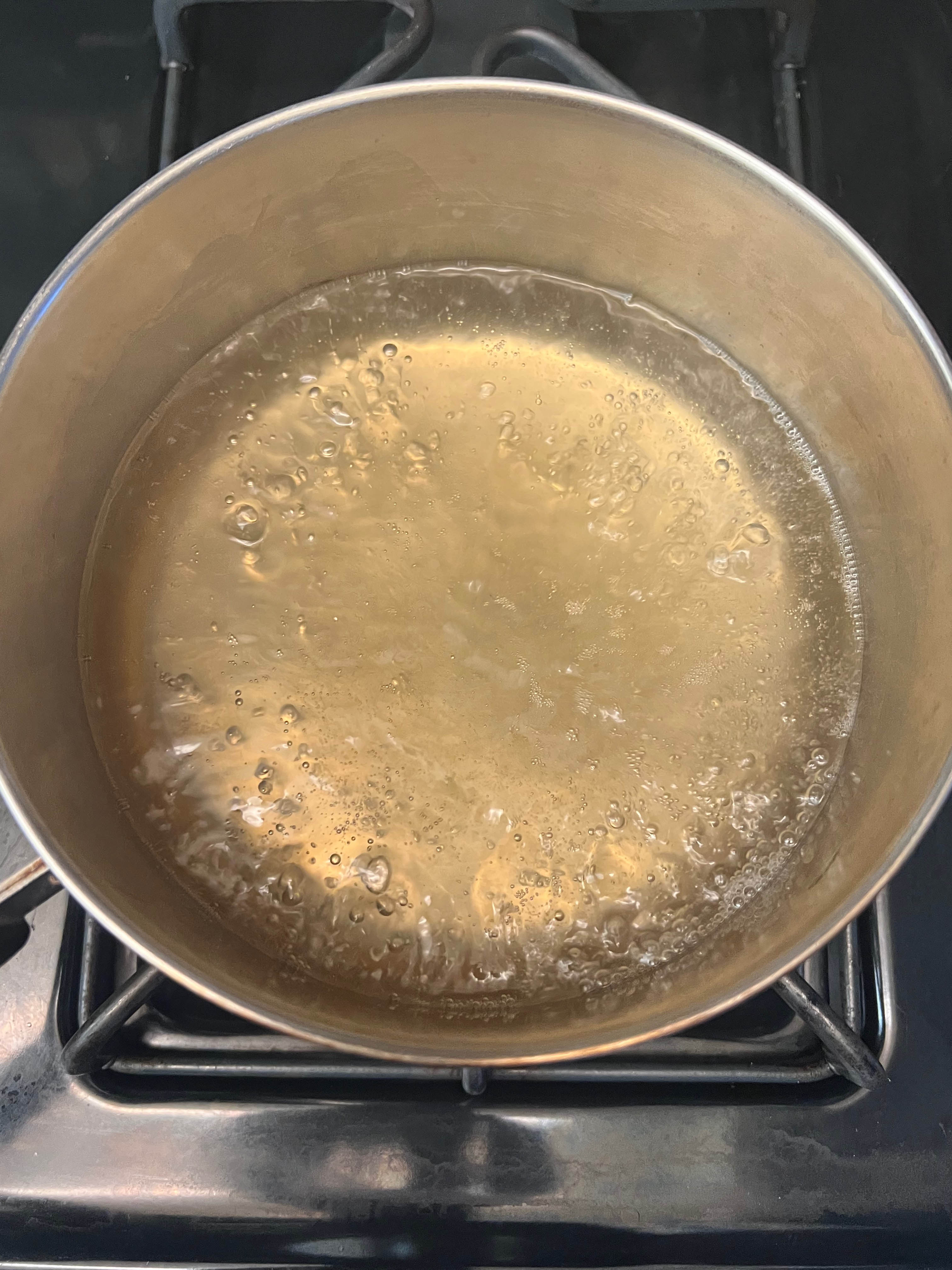 Water, vinegar, and sweetener in a saucepan.