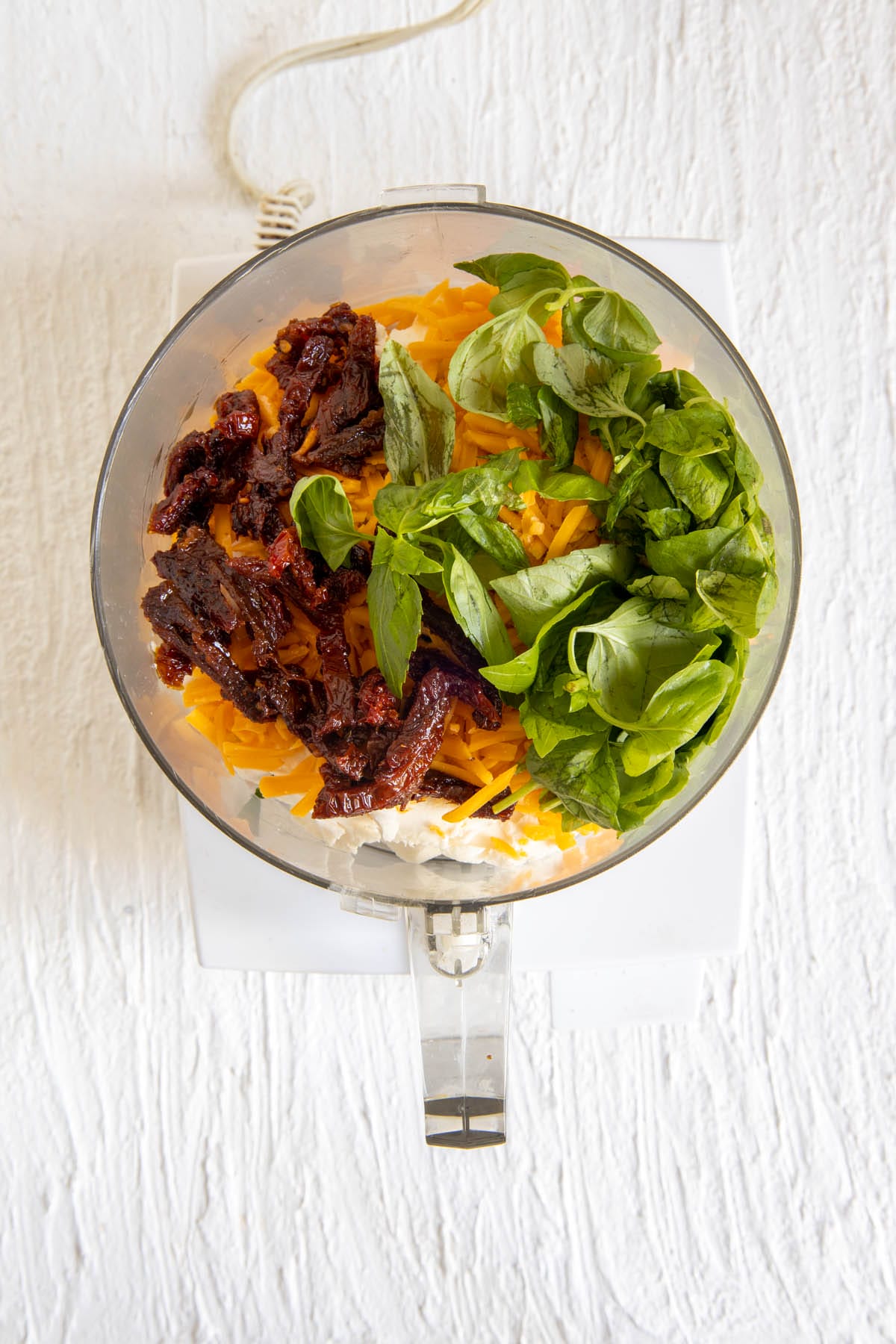 Ingredients in a food processor before blending.