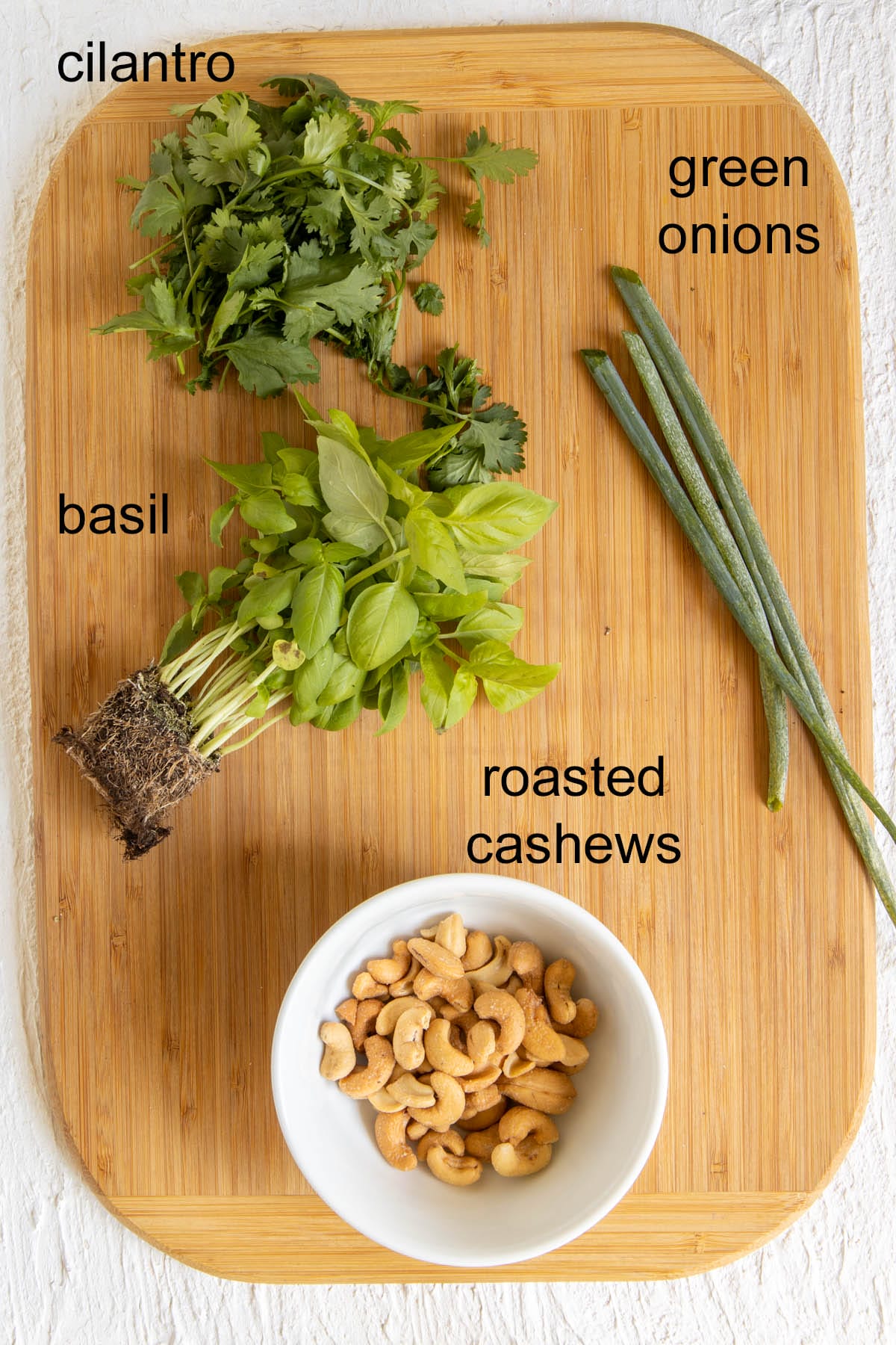Ingredients on a cutting board with labels.