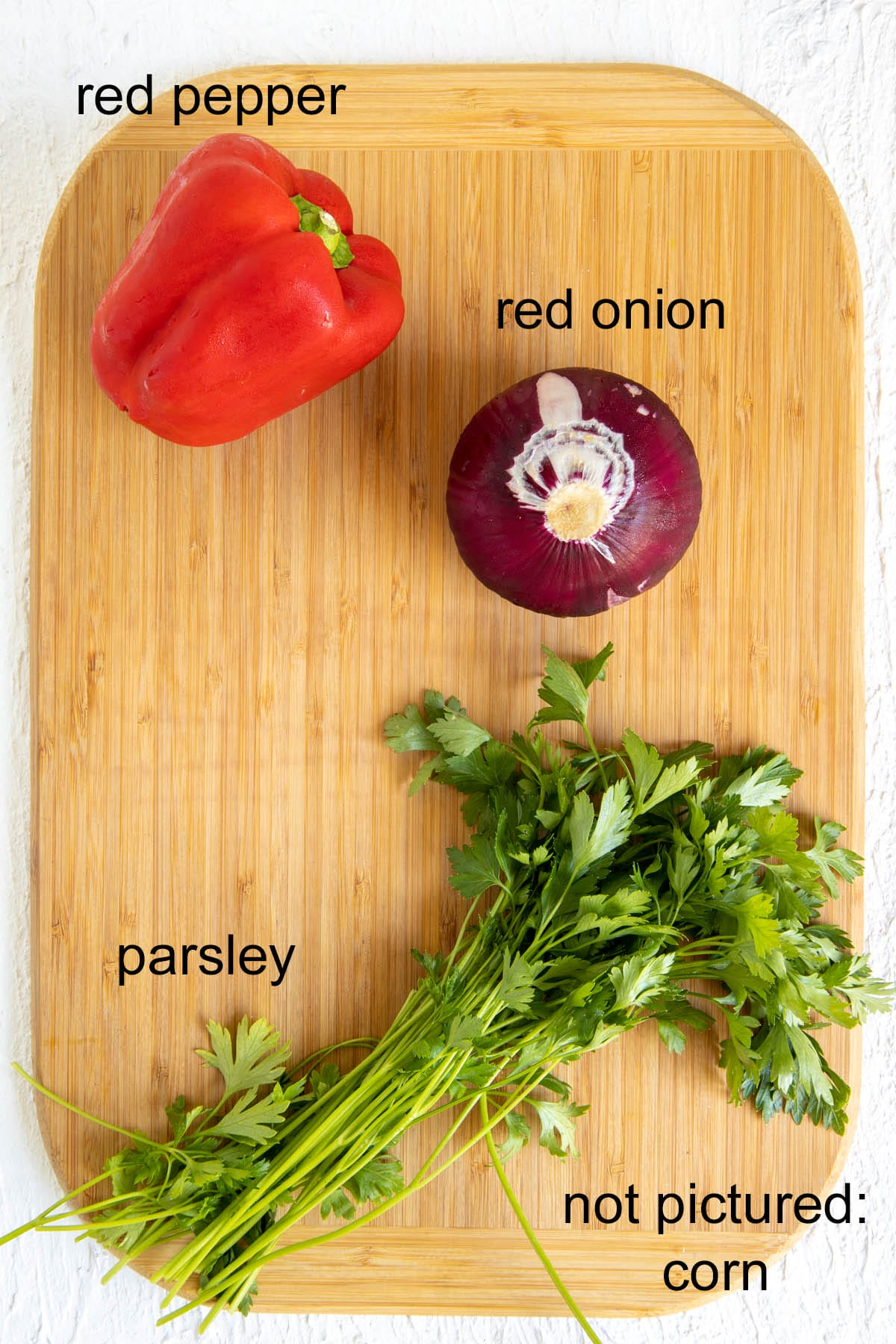 Ingredients on a cutting board with labels.