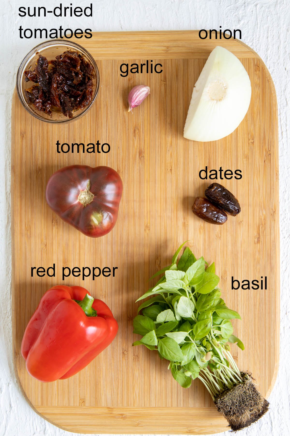 Ingredients on a cutting board with labels.