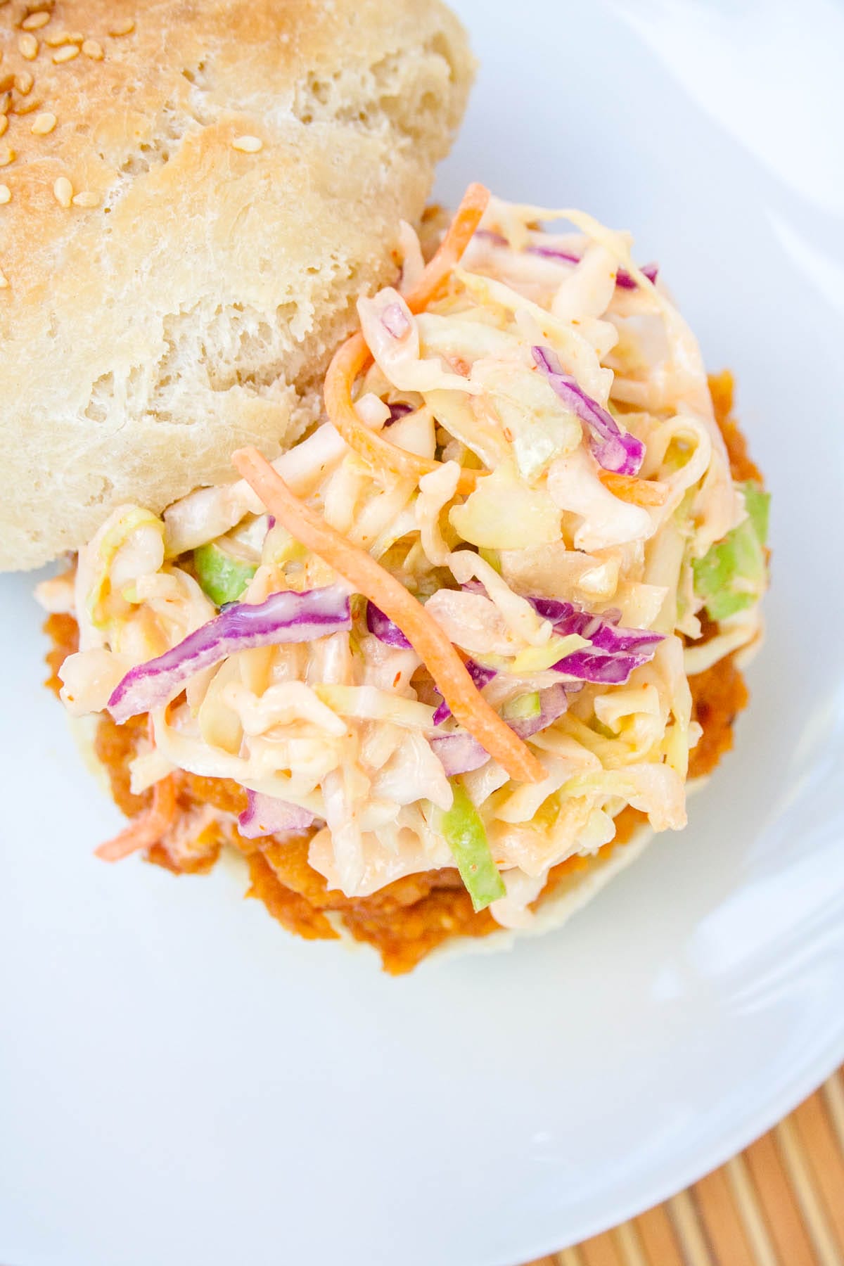 BBQ Lentil Sandwich with sriracha coleslaw on a plate.