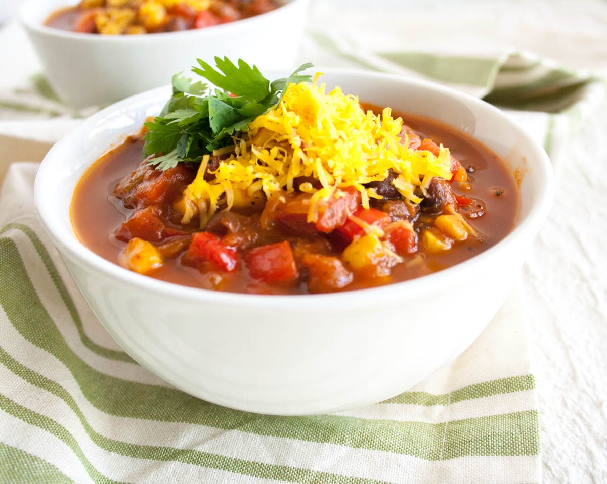 Chili with black beans and corn in two bowls.