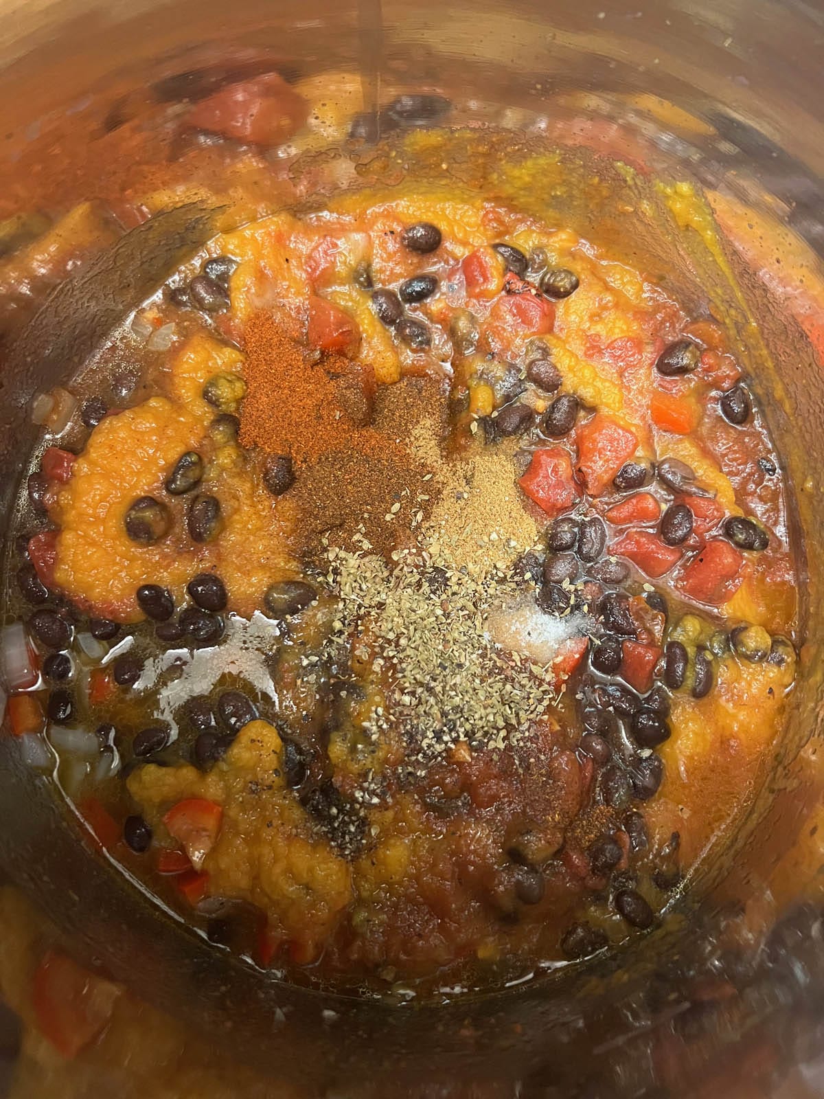 Black beans, spices, fire roasted salsa, fire roasted tomatoes, and butternut squash puree added to the pan.
