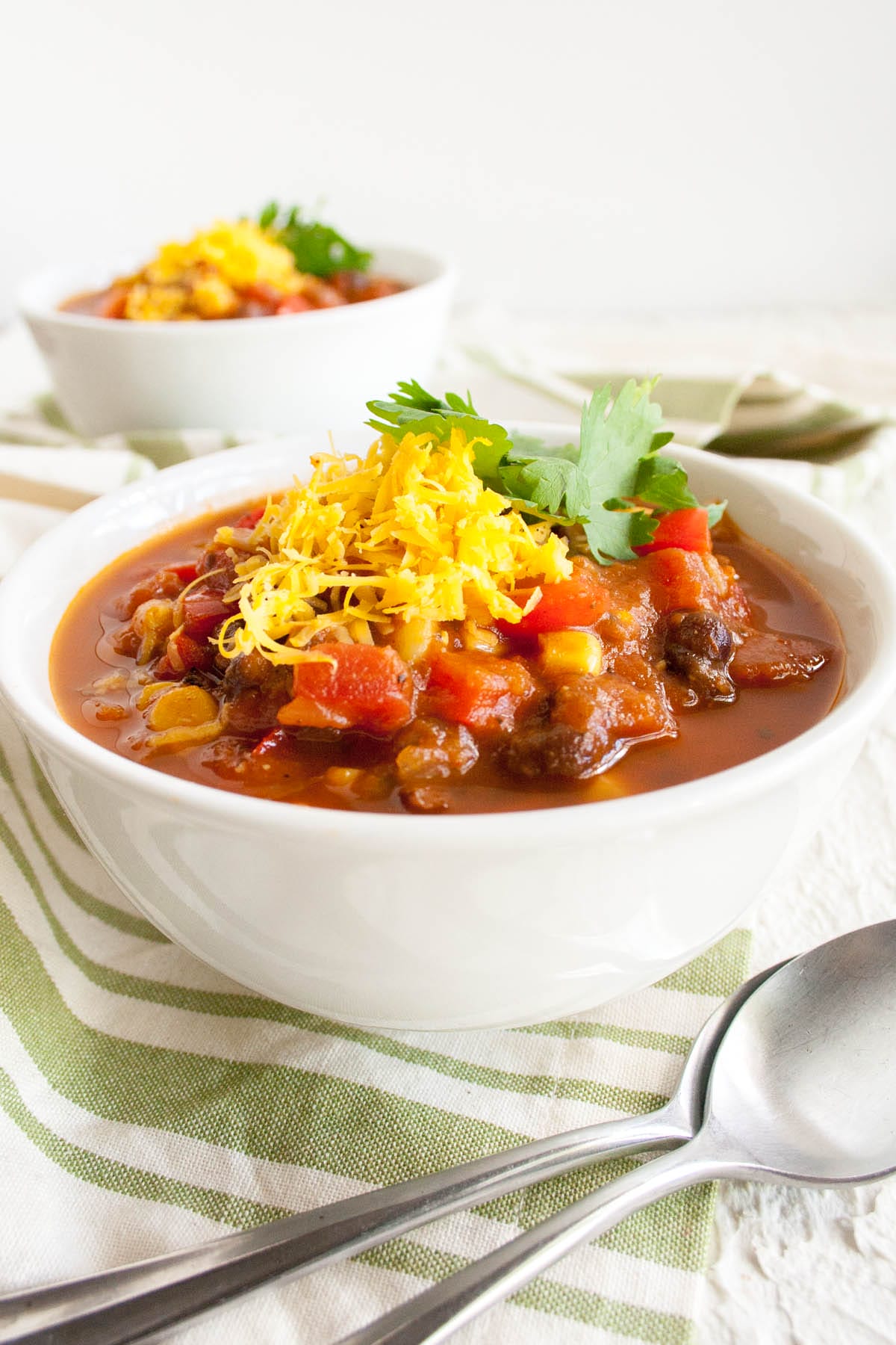 Black Bean and Corn Chili in a bowl with spoons.