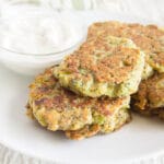 Broccoli Fritters on a plate with dipping sauce.