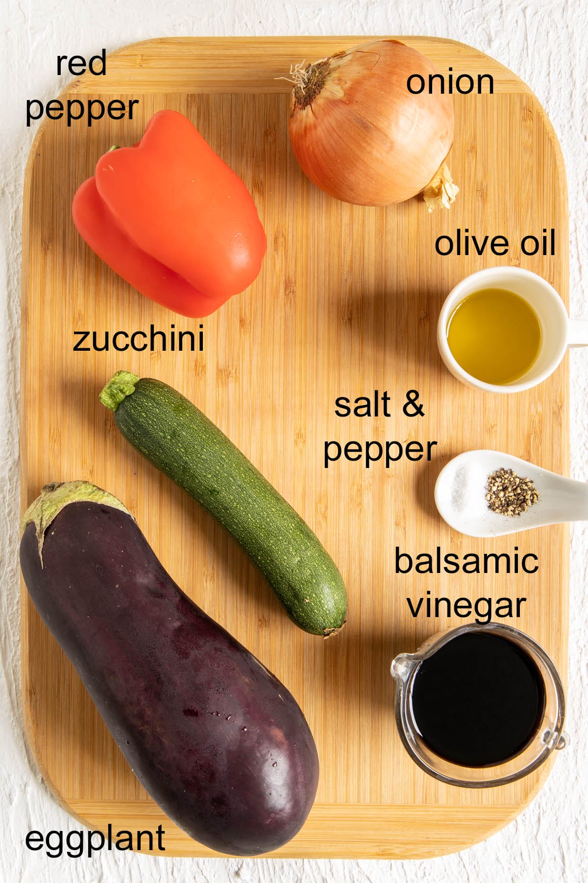 Ingredients on a cutting board with labels.