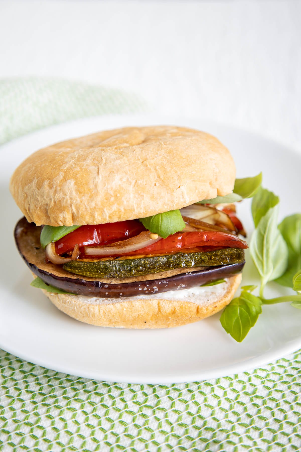 Roasted Vegetable Sandwich on a plate with basil.