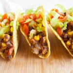 Black Bean and Corn Tacos on a cutting board.