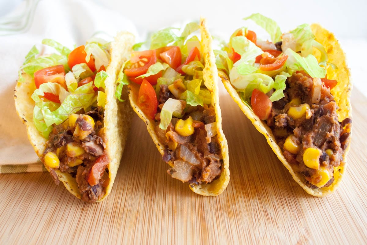 Black Bean and Corn Tacos on a cutting board.