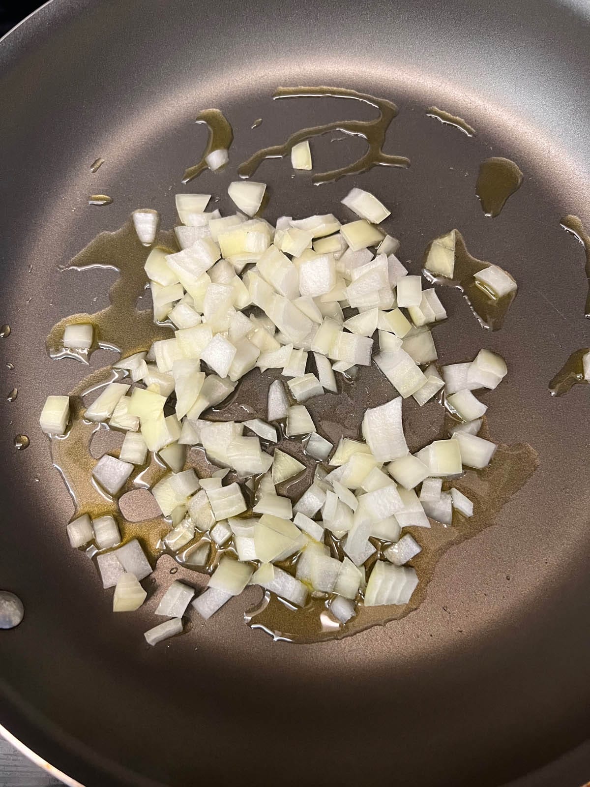Chopped onions in a skillet.